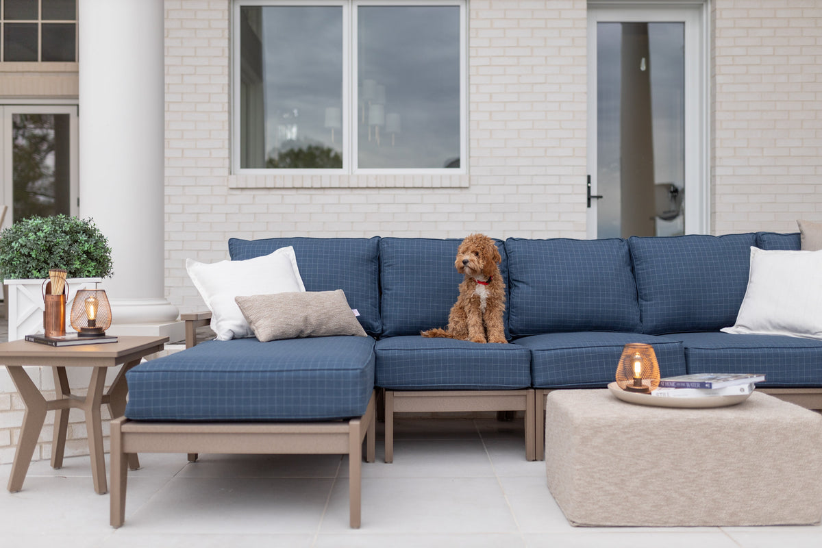 Outdoor sectional with cushions, throw pillows and pouf