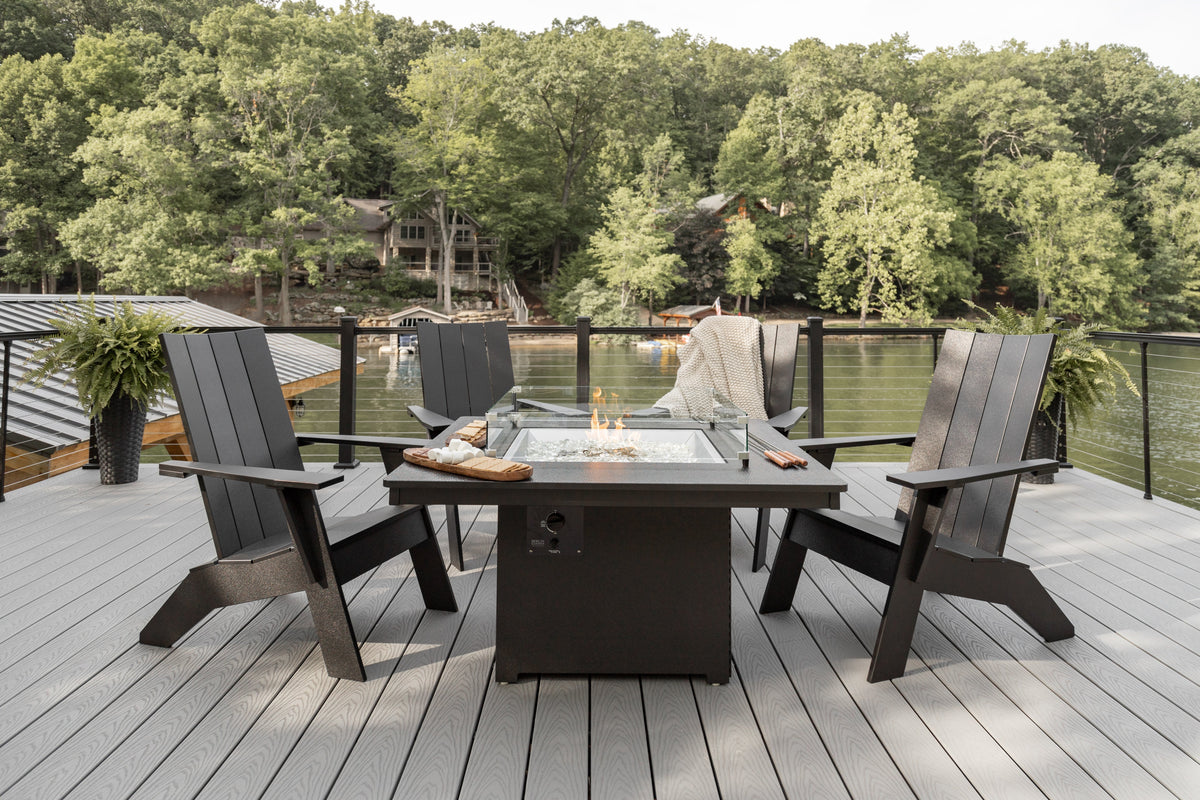 Adirondack chairs around an outdoor fire pit table