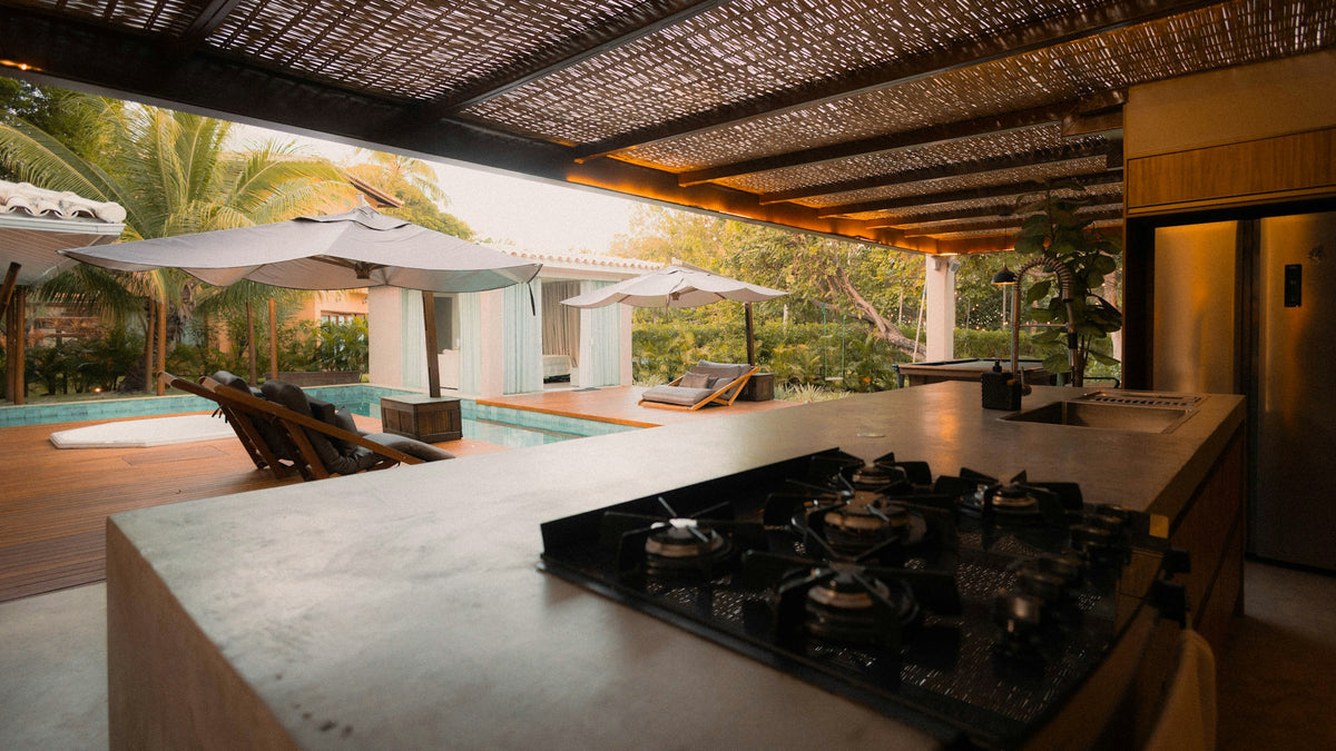 Modern outdoor kitchen beside a pool