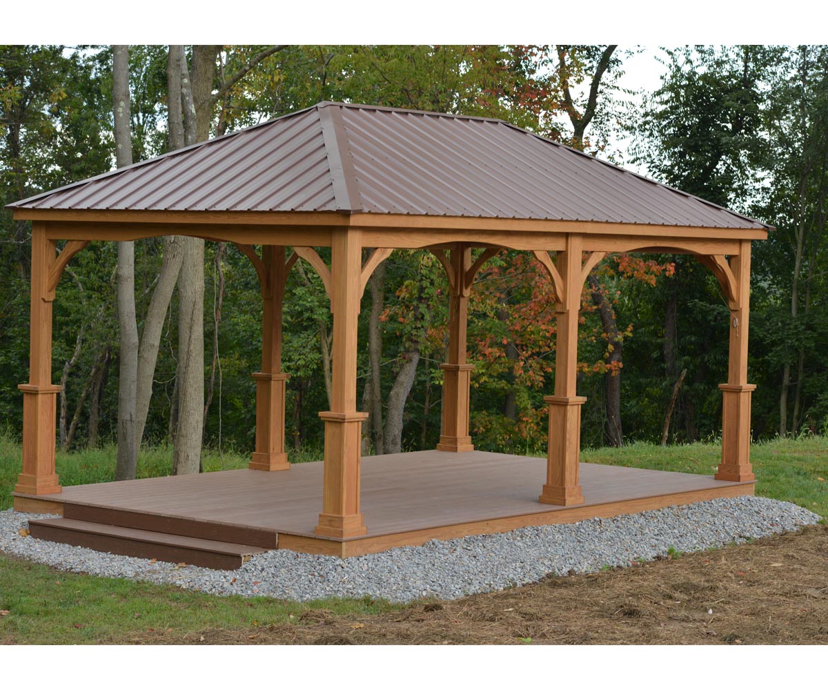 Wooden gazebo with metal roof in a natural setting